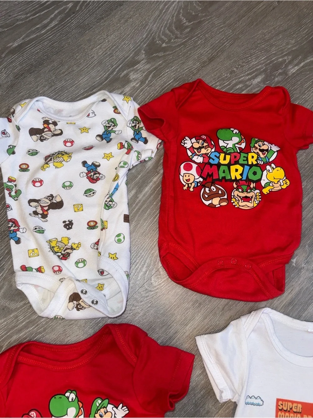 Super Mario baby onesies